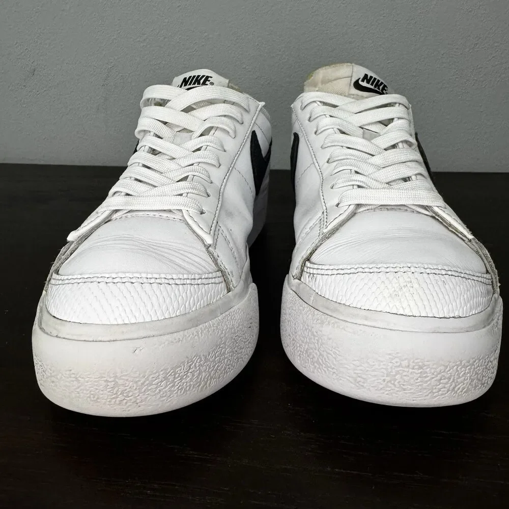Nike White Leather Low-Top Sneakers with Black Swoosh and Yellow Tongue